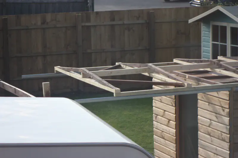 OBSY v1 — roof iteration using inverted UniStrut and channel rollers